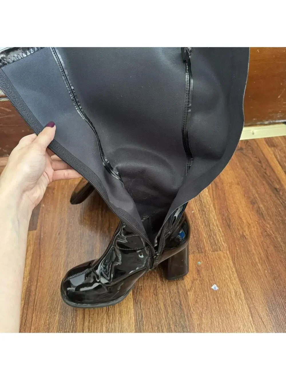 Black knee-high/go go boots with a 4” heel